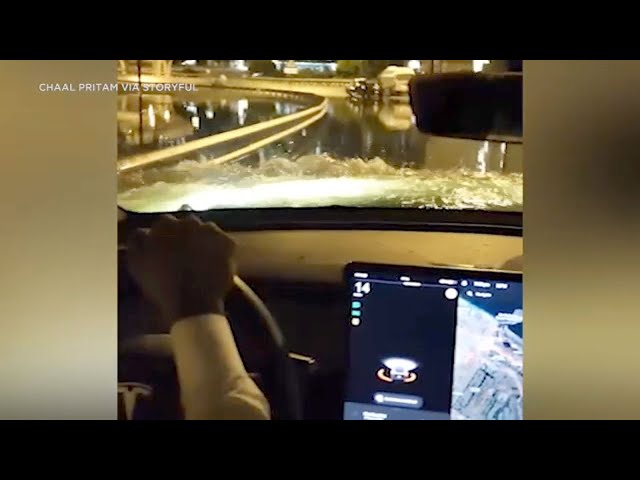 ⁣Tesla cuts through flood waters in Dubai while other cars got stuck