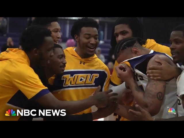⁣College coach surprises basketball player by flying in his family to see him play for the first time