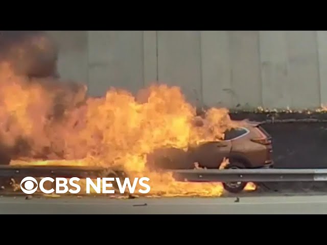 Burning car rescue caught on camera