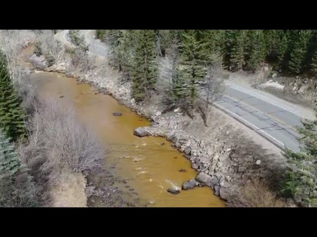 Clear Creek turns orange for miles near Dumont