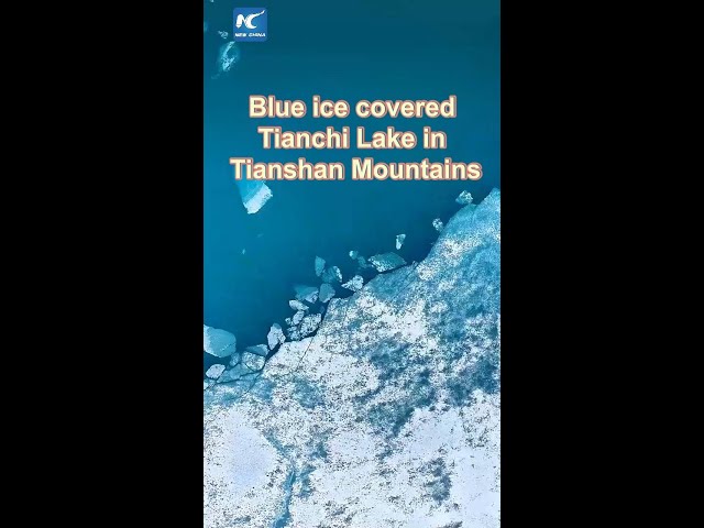 ⁣Blue ice covered Tianchi Lake in China's Xinjiang