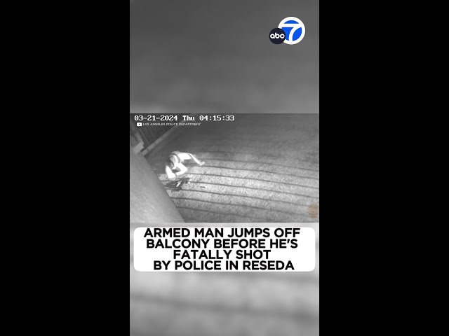 ⁣Armed man jumps off balcony before he's fatally shot by LAPD