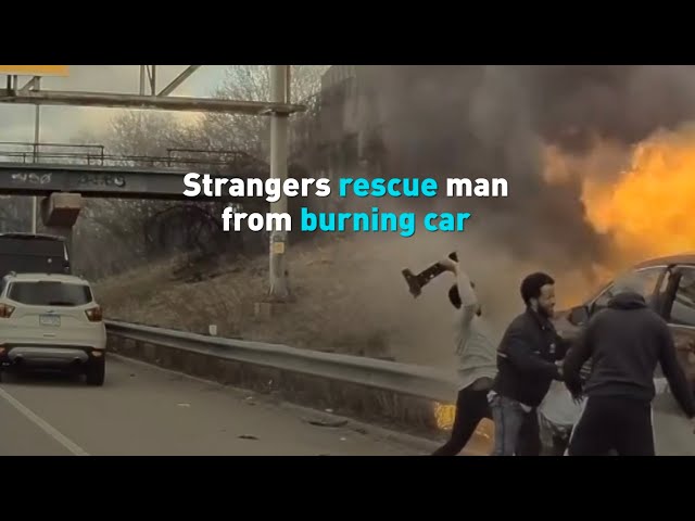 ⁣Strangers rescue man from burning car