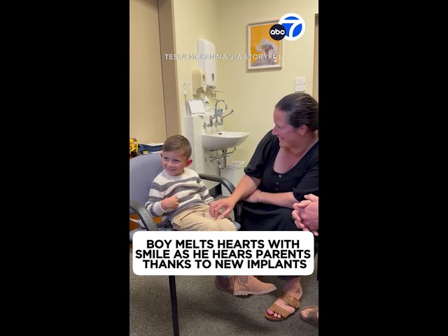 ⁣Boy melts hearts with smile as he hears parents thanks to new implants