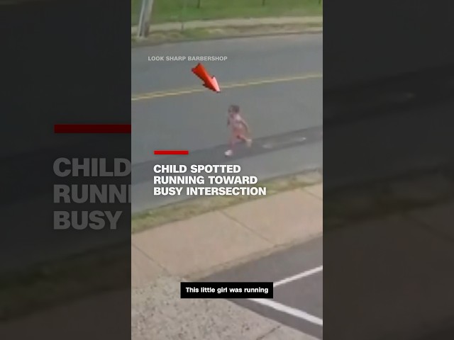 ⁣Child spotted running toward busy intersection