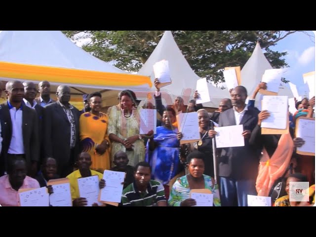 ⁣Lands Minister Nabakooba hands over 320 land titles