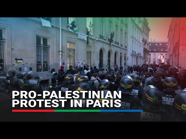 ⁣Pro-Palestinian protesters gather in front of Sciences Po university in Paris