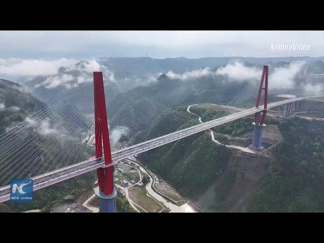 ⁣New towering bridge opens to traffic in China's mountainous Guizhou Province