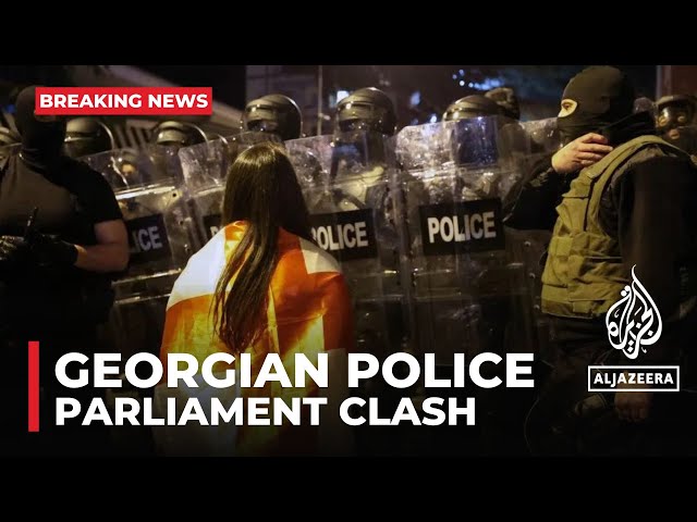 ⁣Georgian police fire tear gas and water cannons at protesters outside Parliament building