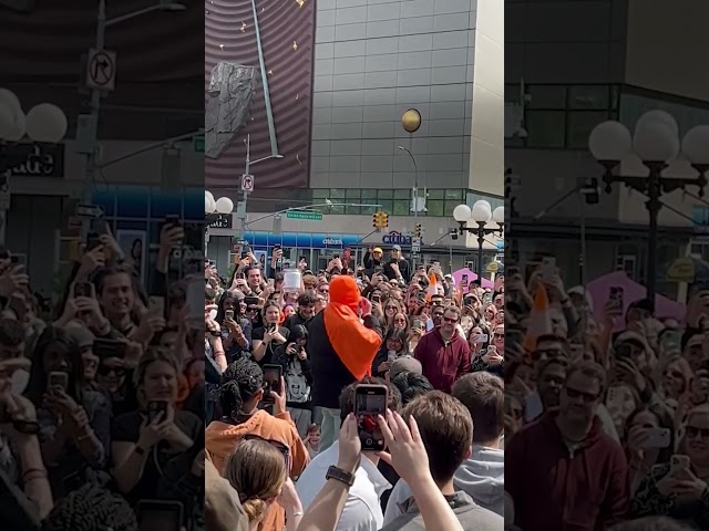 ⁣Crowds of people gather in NYC to watch masked man eat entire jar of cheeseballs #Shorts
