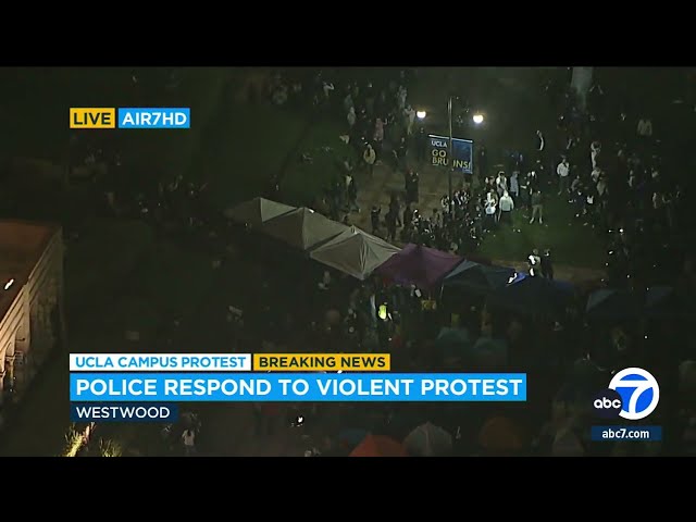⁣Police arrive at UCLA after violent clashes break out