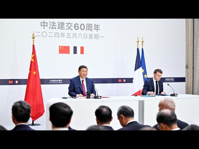 ⁣Le président chinois Xi Jinping s'entretient avec son homologue français Emmanuel Macron
