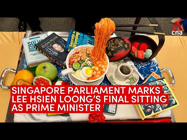 ⁣MPs prepare cake to mark Lee Hsien Loong’s final parliament sitting as Prime Minister