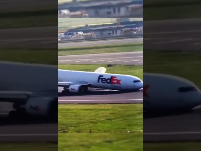 ⁣FedEx plane drags nose across runway after landing gear failure #Shorts