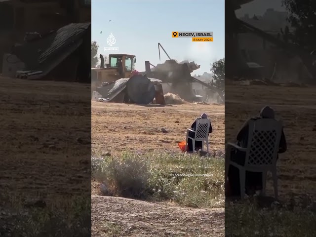 ⁣Palestinian woman watches Israeli demolition of her house
