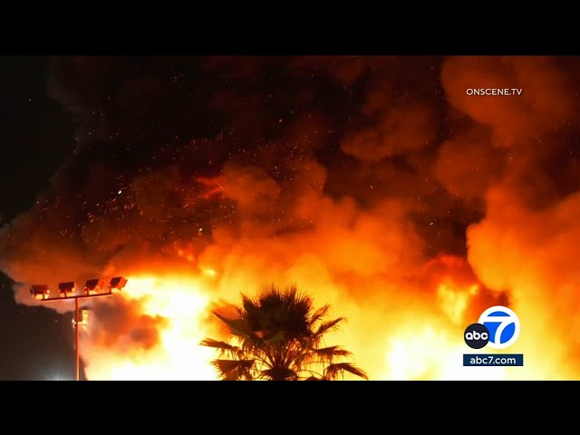 ⁣Massive fire erupts at RV dealership in Santa Fe Springs