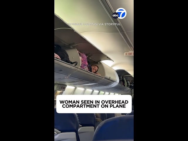 Woman seen in overhead compartment on plane
