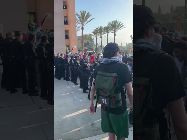 ⁣Protesters clash LAPD outside Pomona College Graduation