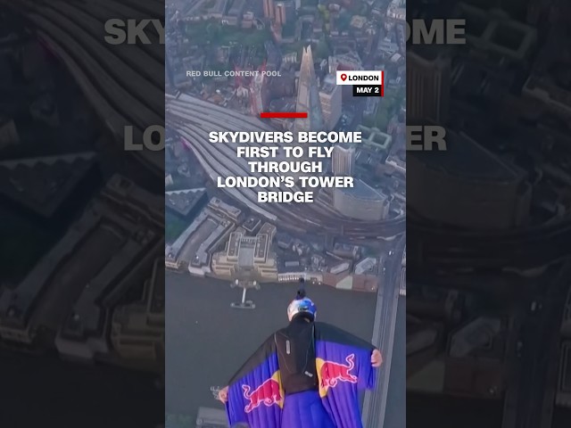 ⁣Skydivers become the first to fly through London's Tower Bridge