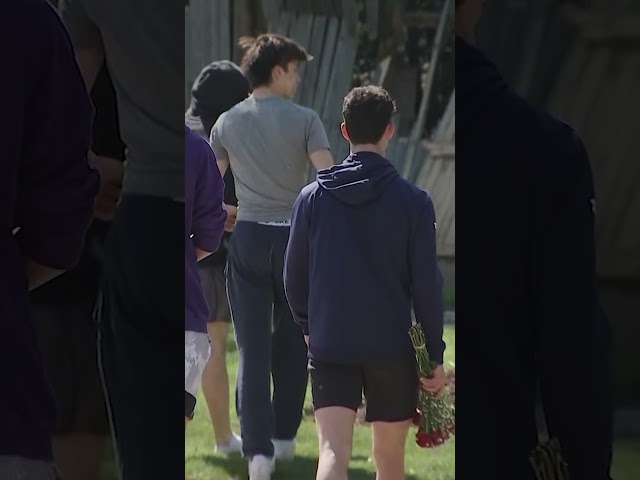⁣Friends lay flowers at site of crash that killed 17-year-old in Chicago suburb