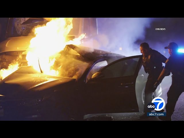 ⁣Police pull people from burning car after 710 Fwy crash in Long Beach