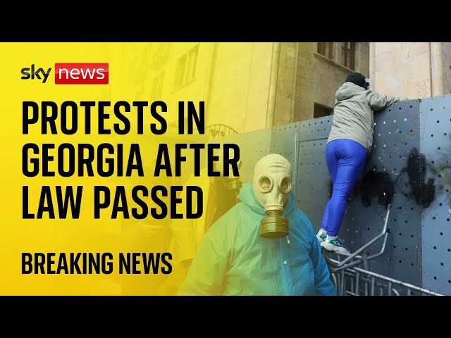 ⁣Georgia Protests: Protesters outside parliament building after divisive bill passes
