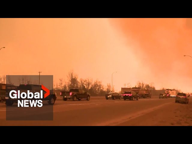 ⁣Alberta explores other route out of Fort McMurray as wildfire forces residents to flee again