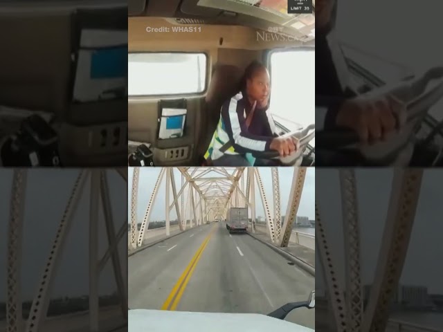 ⁣Truck driver crashes and dangles from bridge
