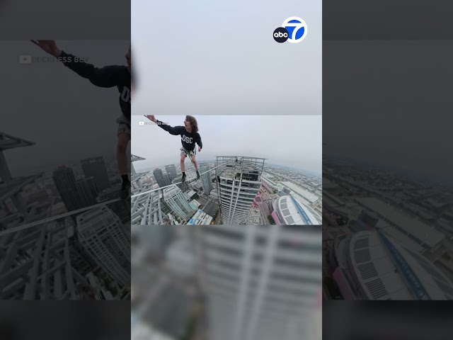 ⁣Daredevil 'Reckless Ben' walks tightrope between skyscrapers in downtown L.A. in dangerous