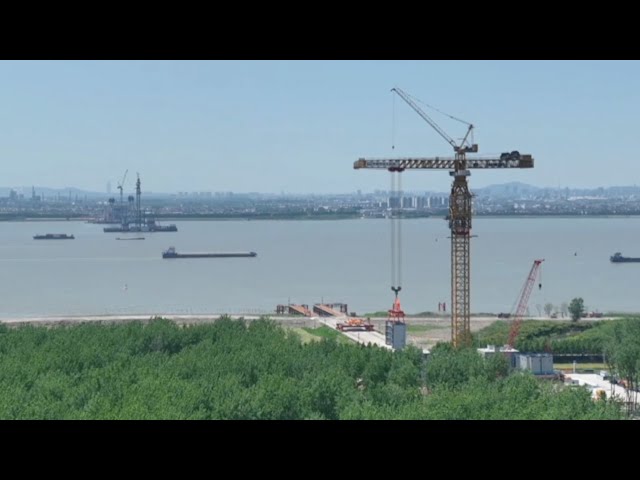 ⁣'Super crane' helps world's tallest suspension bridge stand proud
