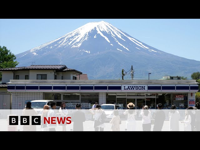 ⁣Japanese town blocks iconic Mount Fuji view to deter tourists | BBC News