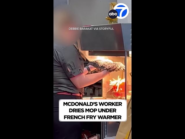 ⁣NOT LOVIN' IT: McDonald's worker dries mop under French fry warmer