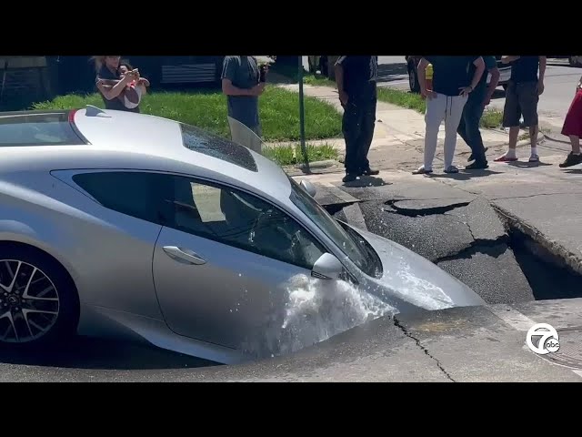 ⁣Car falls into sinkhole as street collapses in Southwest Detroit