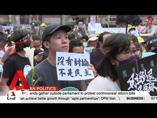 ⁣Taiwanese gather in protest against controversial reform bills
