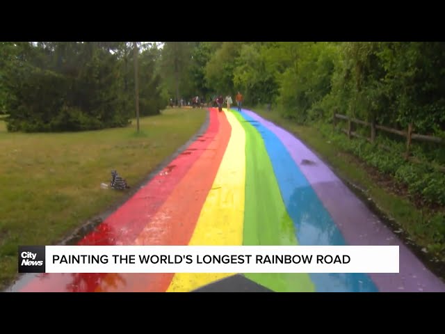 ⁣Painting the world's longest rainbow road