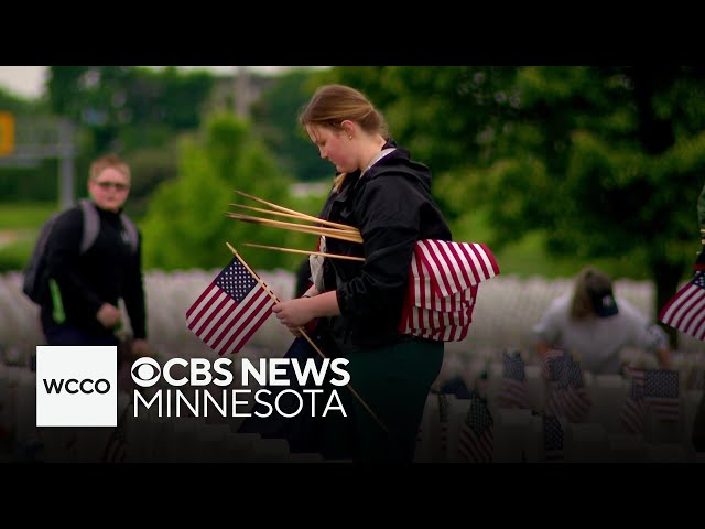 ⁣Family places flags at Fort Snelling as Memorial Day tradition
