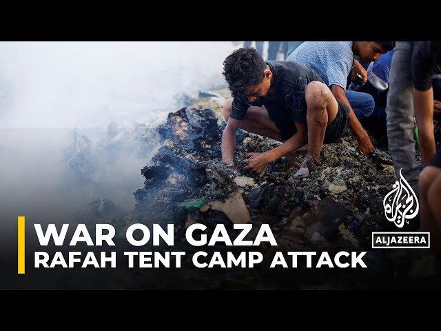⁣Palestinians search charred remains of Rafah tent camp
