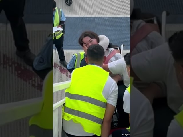 ⁣Disabled woman carried down flight of stairs from plane #Shorts