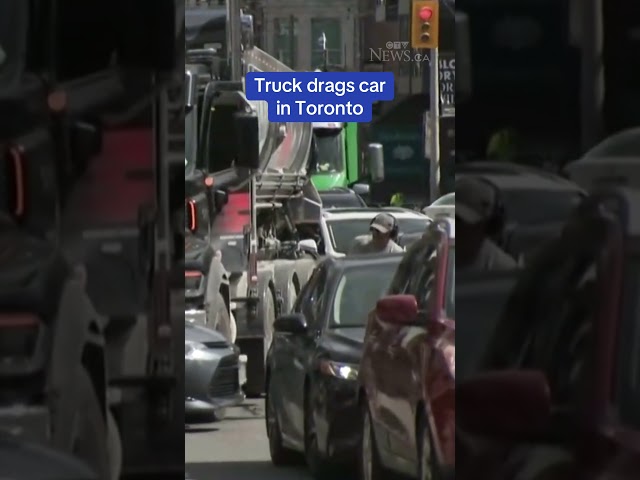 ⁣Video shows driver frantically getting out of car being pushed by truck on Avenue Road in Toronto