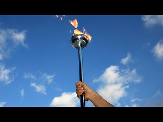 ⁣Olympic torch passes through Normandy