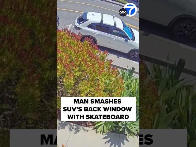 ⁣Man randomly smashes woman's SUV with skateboard in Long Beach