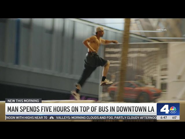 ⁣Man stays on top of bus for five hours in downtown LA