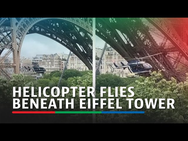 ⁣Police helicopter flies beneath Eiffel Tower in Olympics exercise