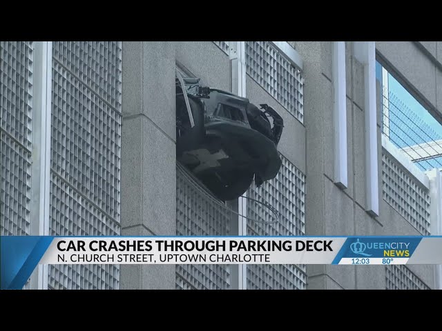 ⁣Vehicle dangles from uptown Charlotte parking deck