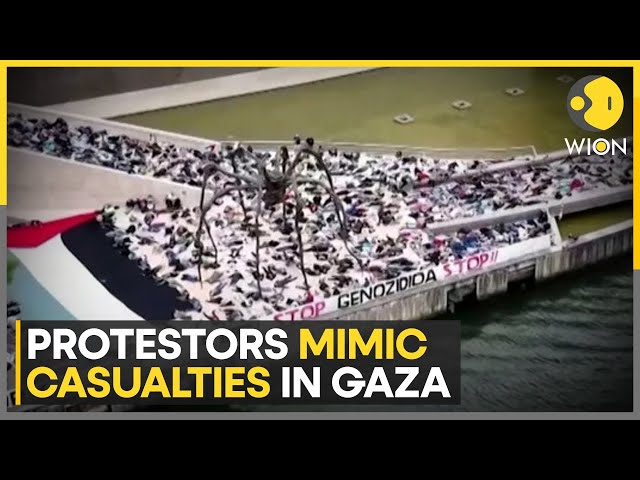 ⁣Spain: Protesters mimic casualties in Gaza by lying on the ground | WION