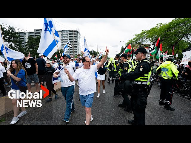 ⁣Toronto "Walk with Israel" march confronted by pro-Palestinian protesters
