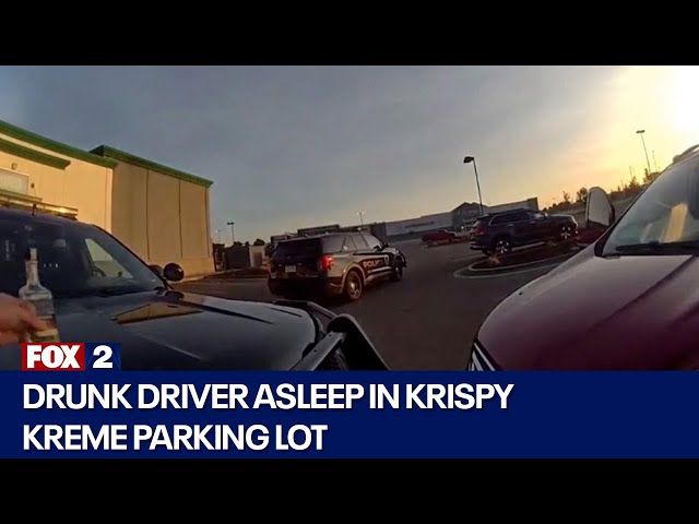 ⁣Drunk driver asleep in Krispy Kreme parking lot with empty bottle of tequila