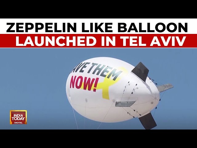 ⁣Israel-Gaza War: Zeppelin-like Balloon Launched In Tel Aviv To Demand Release Of Hostages