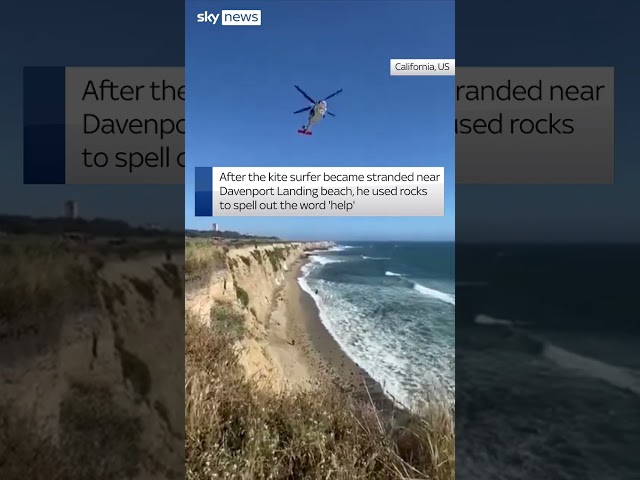⁣Kite surfer spells 'help' to get rescued