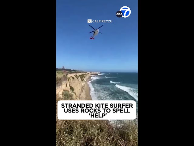 ⁣Stranded kite surfer rescued after spelling “help” with rocks